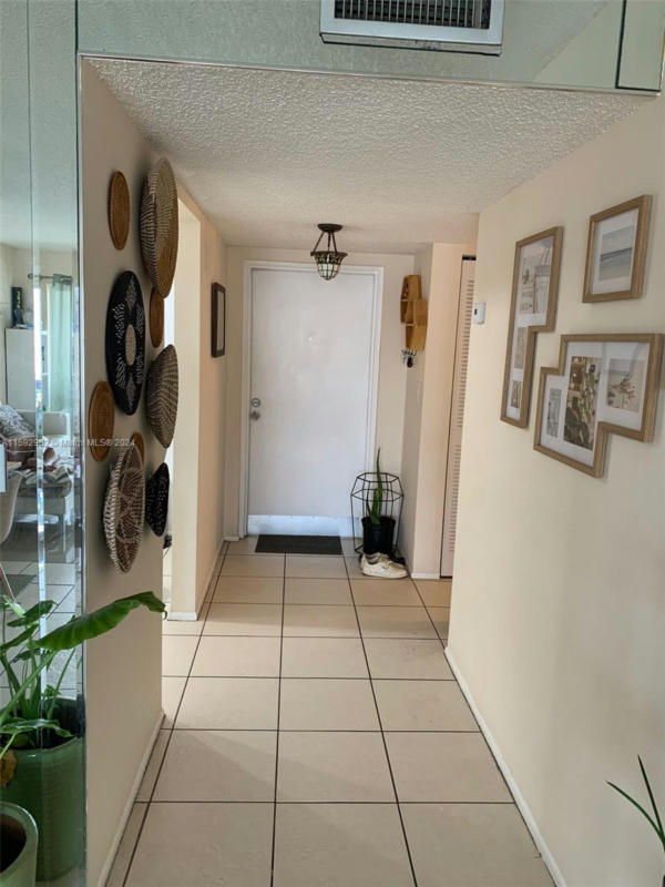 8350 SANDS POINT BLVD APT E306, TAMARAC, FL 33321, photo 1 of 14