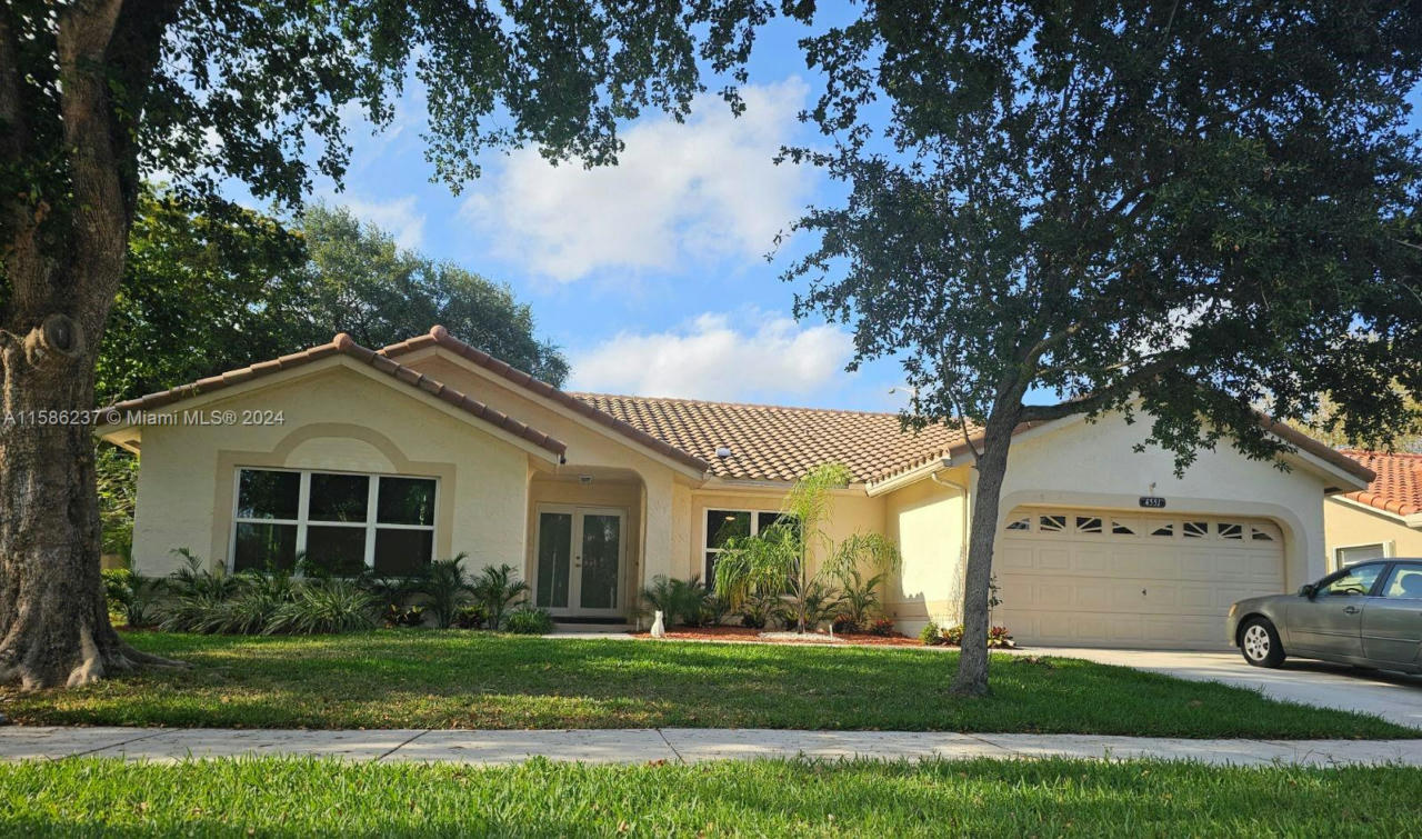 4551 NW 52ND ST, COCONUT CREEK, FL 33073, photo 1 of 12
